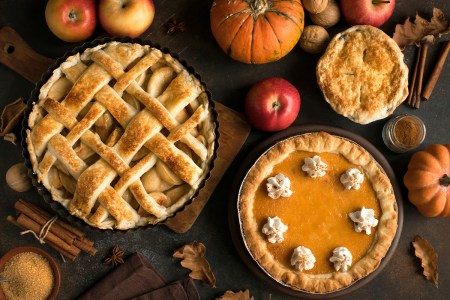 A pumpkin and apple pie on a Thanksgiving table. Here's where to get holiday desserts for Thanksgiving in Miami.