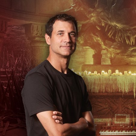 Ramin Djawadi, composer of the "Game of Thrones" series, pictured in front of scenes from "House of the Dragon"