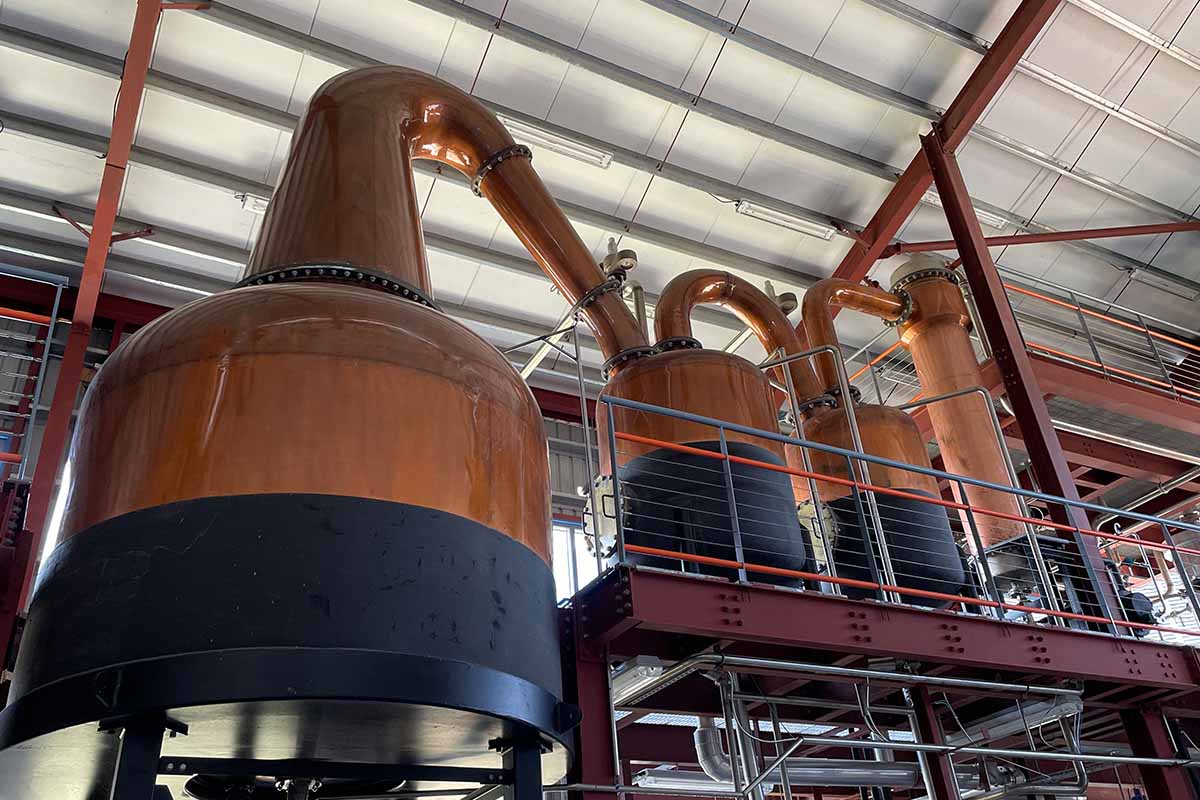 The modern stills inside Renegade Rum's distillery
