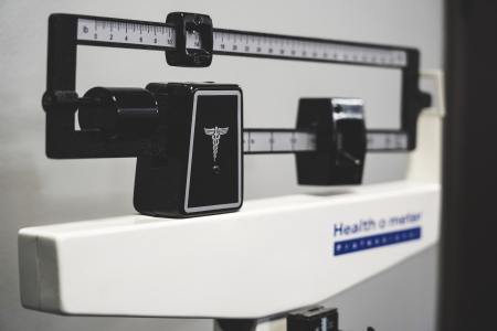 A close-up image of a scale. We take a look at a new fitness and wellness trend: accountability coaches.