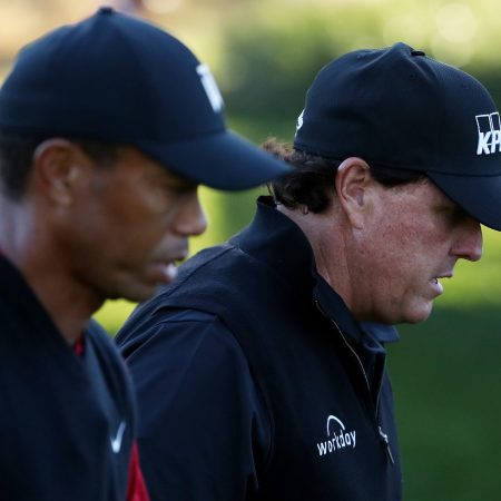 Tiger Woods and Phil Mickelson walk during The Match in 2018 in Las Vegas.