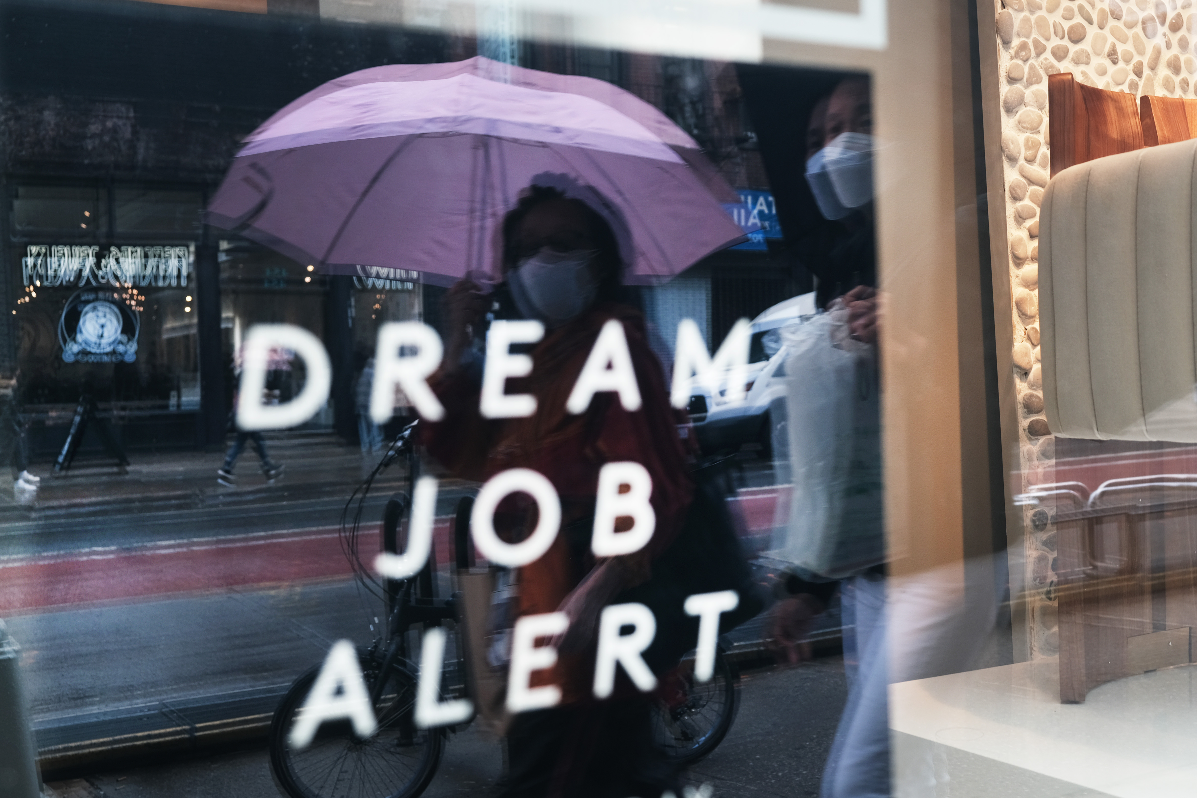 A creative "help wanted" sign on a window in New York.
