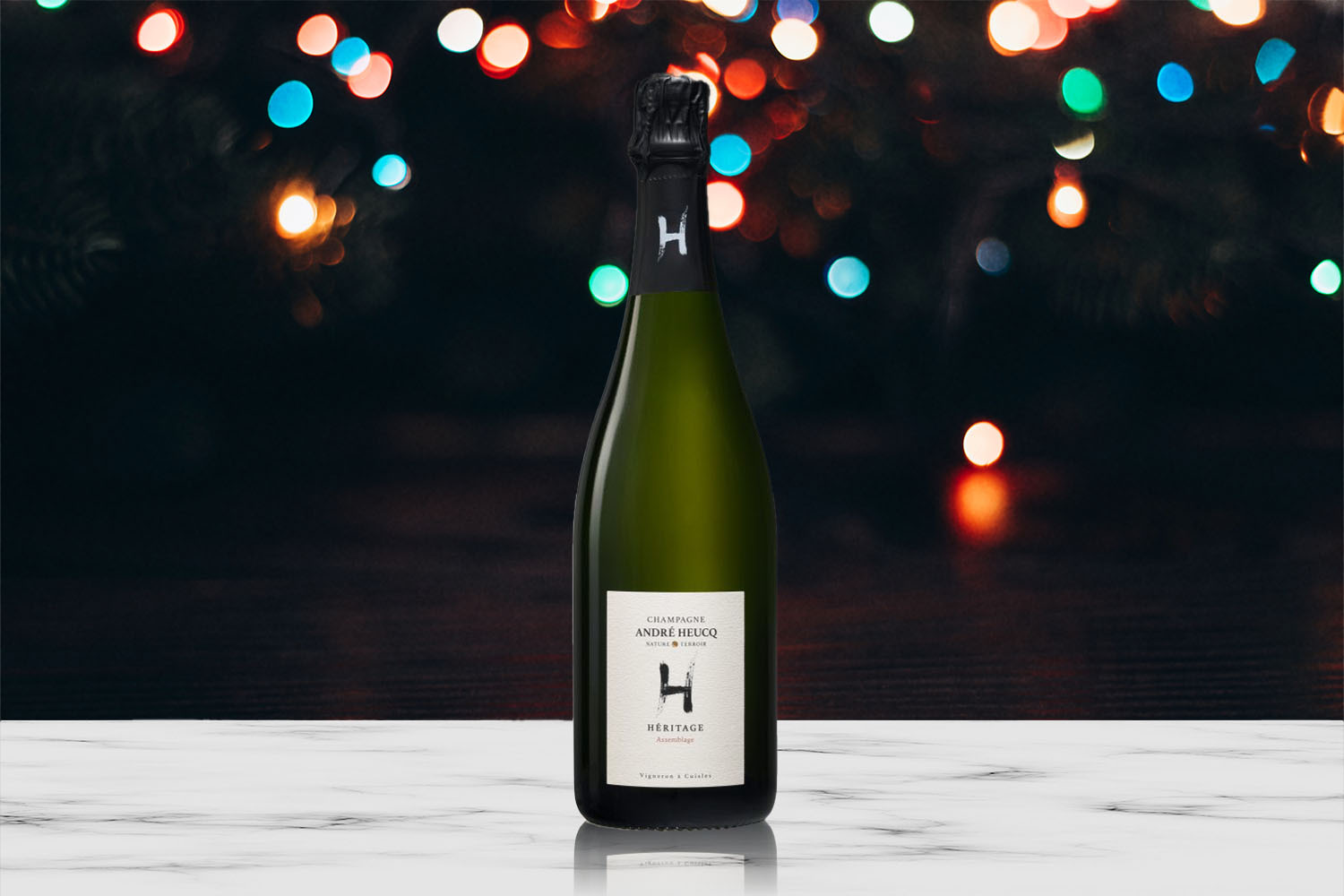 Champagne André Heucq Héritage Assemblage in front of holiday lights