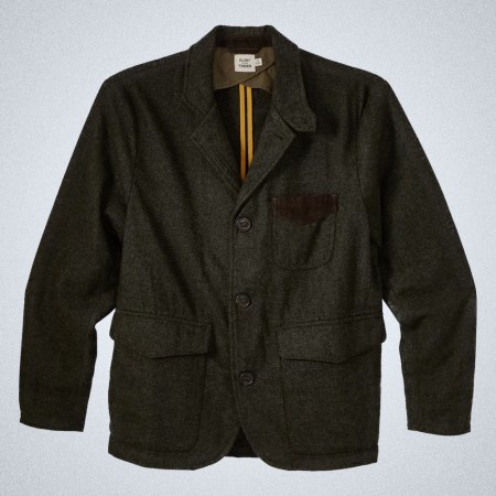 a green wool Flint and Tinder hunting blazer on a grey background