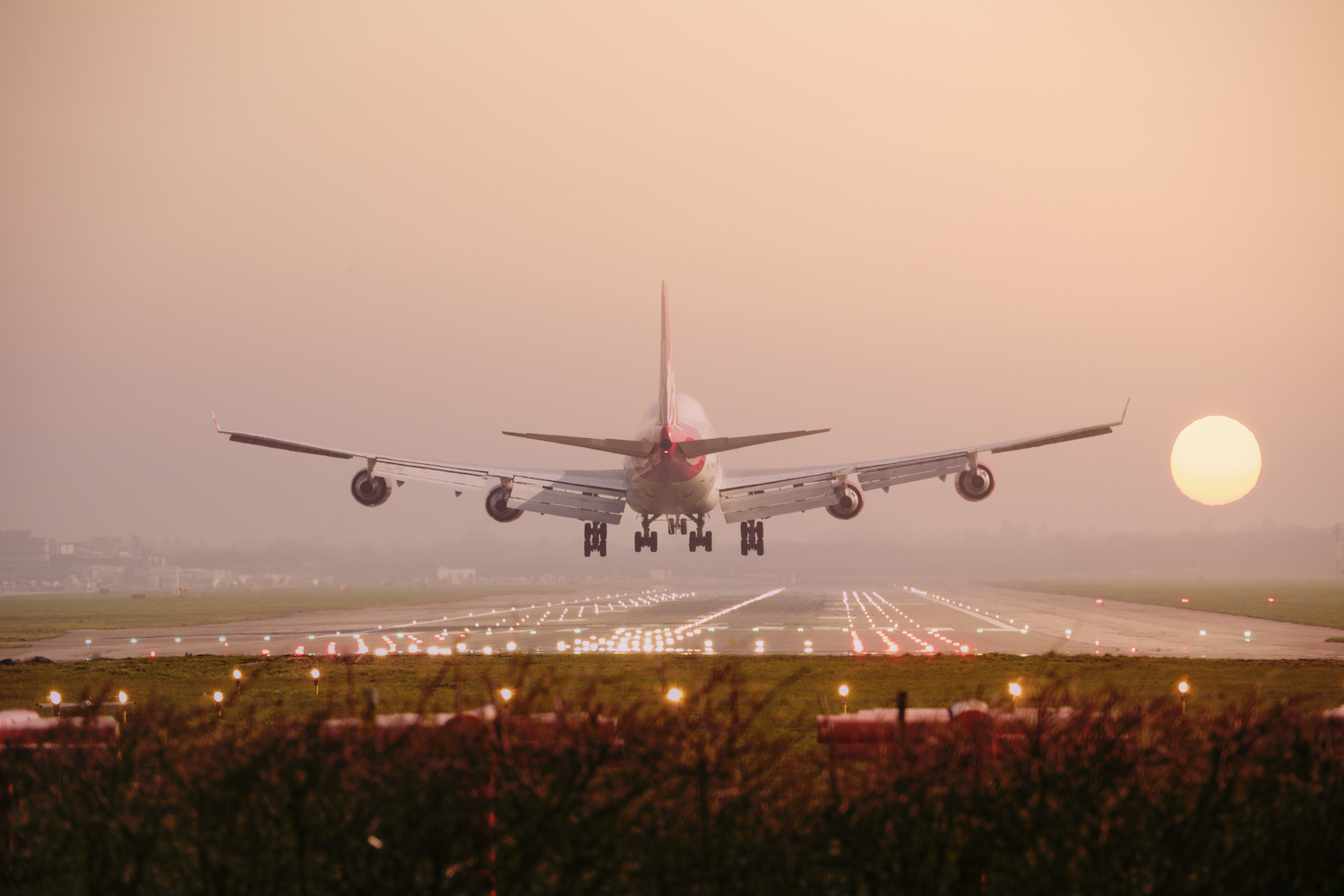 Boeing 747 airplane Landing into sunset