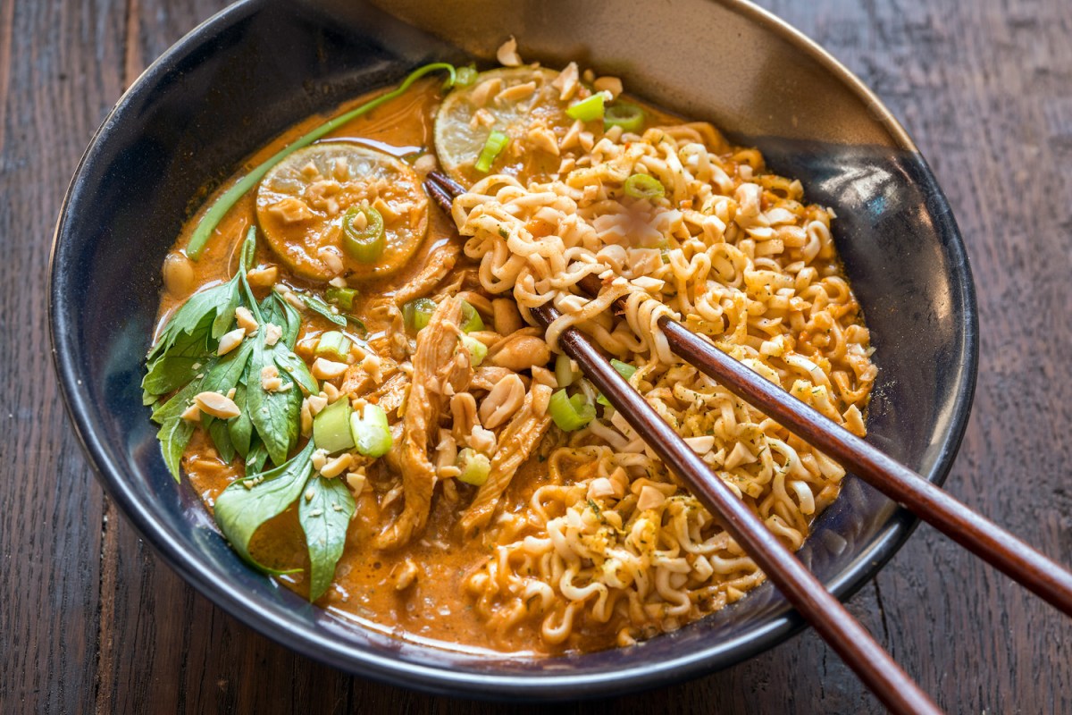 Ramen noodle soup with peanut sauce and chicken