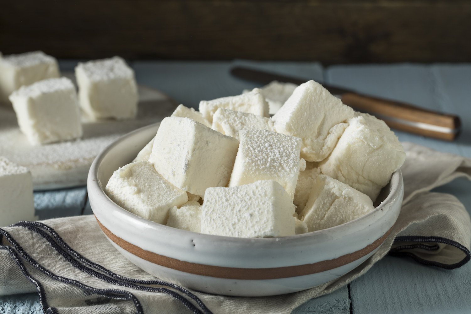 a bowl of homemade square marshmallows