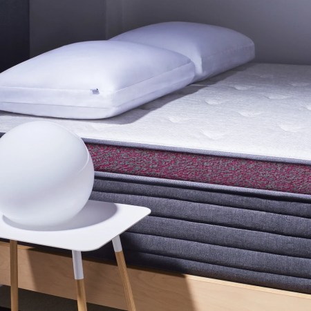 a Helix mattress next to a bedsidetable