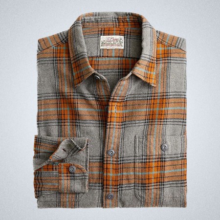 a grey and orange J.Crew flannel on a grey background