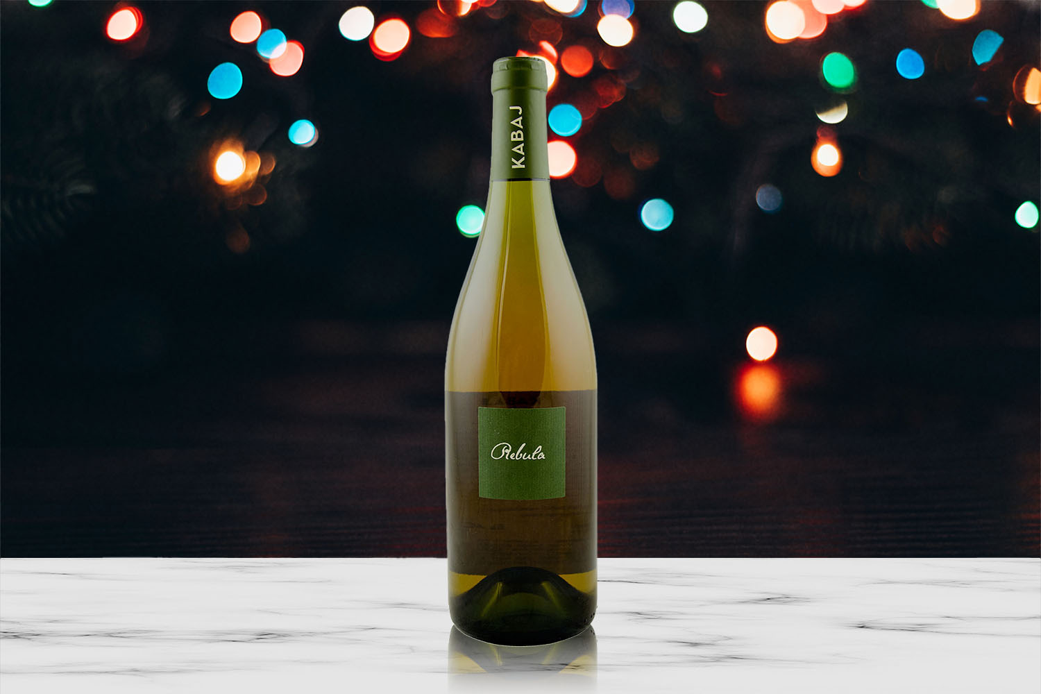 Kabaj Rebula wine in front of holiday lights