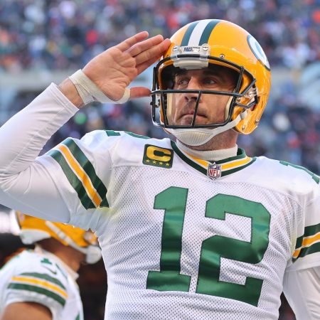 Aaron Rodgers of the Green Bay Packers gives a salute while on the field