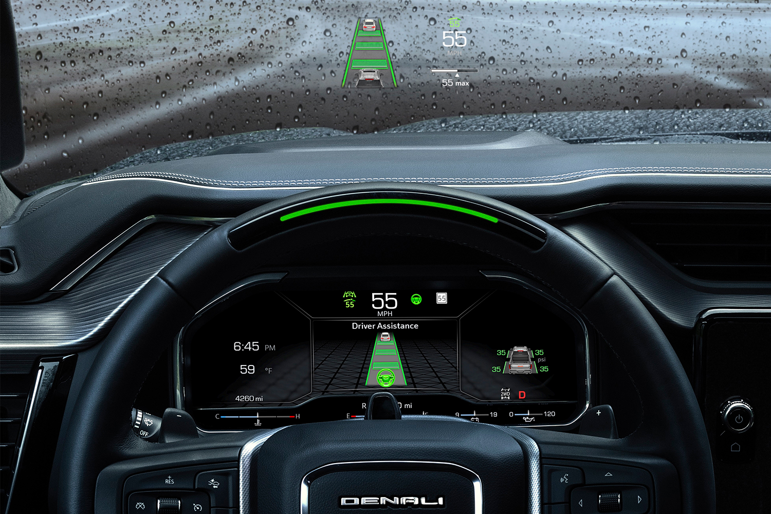 The Super Cruise technology and head-up display displayed on the dashboard and windshield of the GMC Sierra Denali Ultimate pickup truck