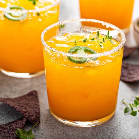 Spicy pineapple and mango refreshing margarita with chips and salsa. According to a new report by Bacardi, we'll be drinking a lot of spicy margaritas in 2023.