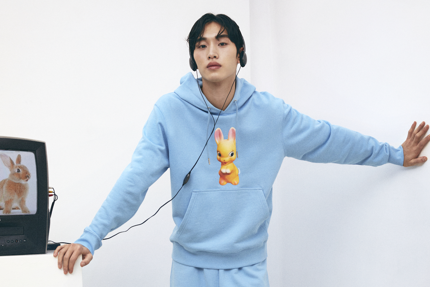 a model in a baby blue Sandro Paris Lunar New Year Rabbit Hoodie