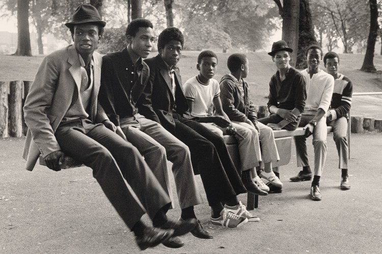 Young Men on See - Saw, Handsworth Park, Birmingham , 1984, printed 2021 gelatin silver print image: 30.1 x 45.4 cm (11 7/8 x 17 7/8 in.) sheet: 40.4 x 50.5 cm (15 7/8 x 19 7/8 in.) National Gallery of Art, Washington, Alfred H. Moses and Fern M. Schad Fund
