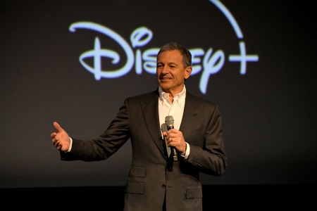 CEO Bob Iger speaking in front of a Disney+ logo