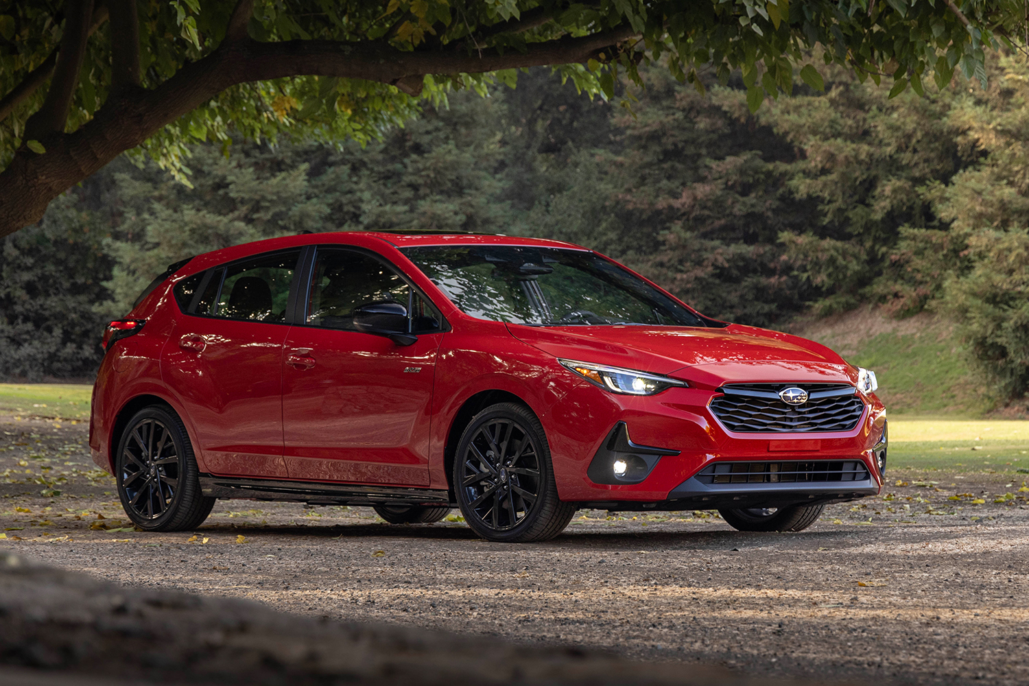 A red 2024 Subaru Impreza RS, which is now only available as a 5-door hatchback instead of a sedan