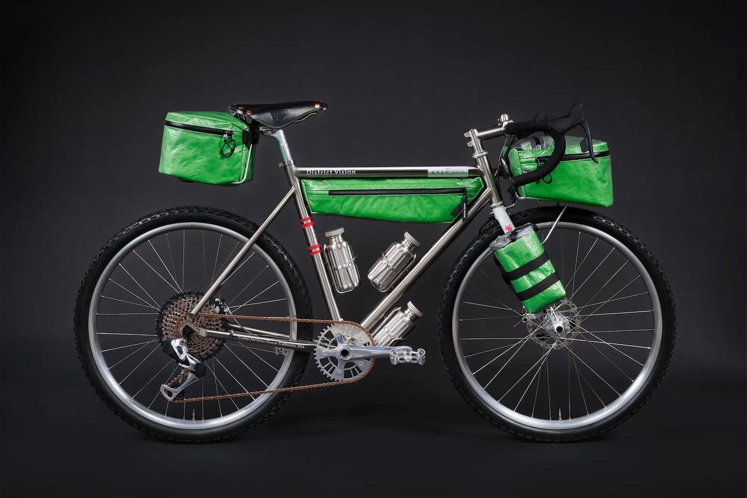 a green District Vision bike on a black background