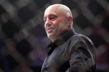 Joe Rogan walks inside the Octagon during the UFC 282 event at T-Mobile Arena on December 10, 2022 in Las Vegas, Nevada.