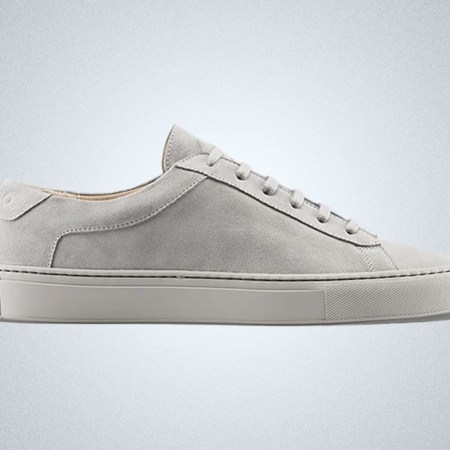 a single grey Koio sneaker on a grey background