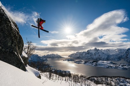 Skier Adam Ü jumping off a cliff in Norway's Lofoten Islands