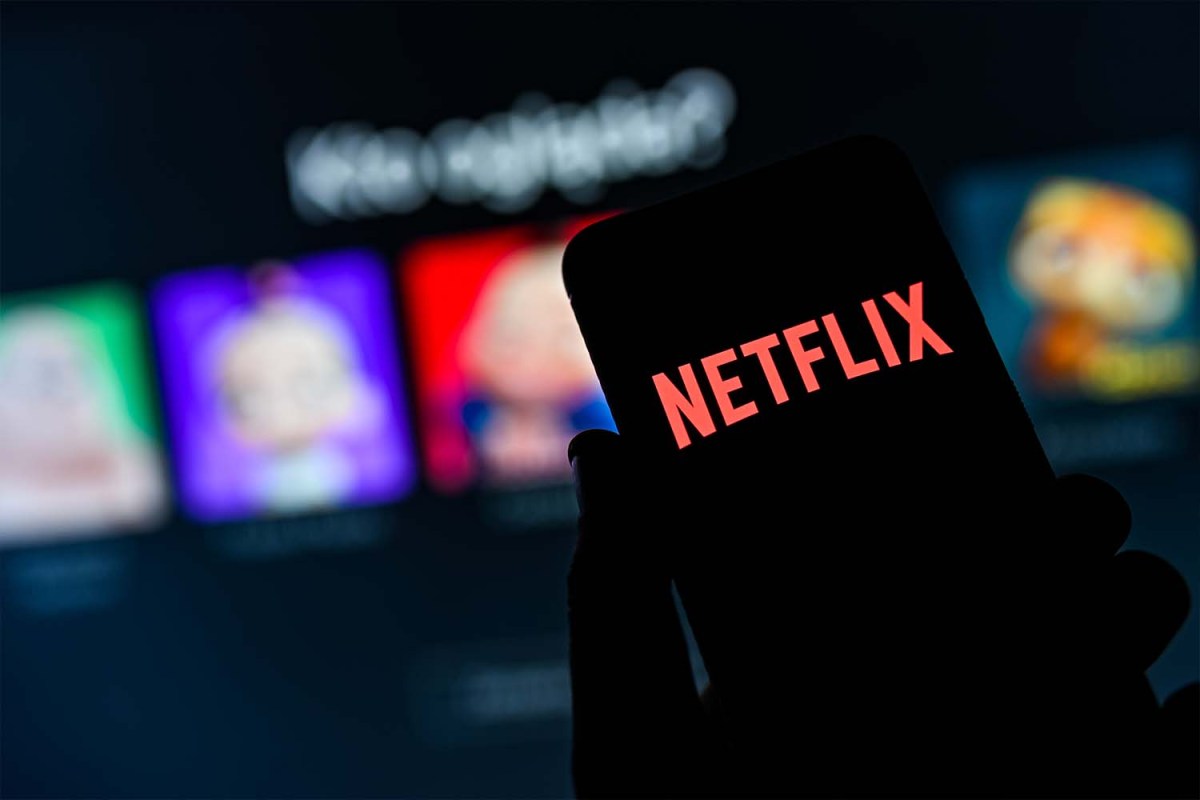 A Netflix logo seen displayed on a smartphone. The streaming platform is hiring flight attendants for its fleet of private jets.