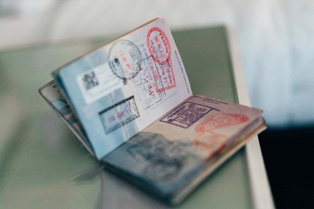 A passport open on a table. What's the most powerful passport for 2023? The ranking was just released.