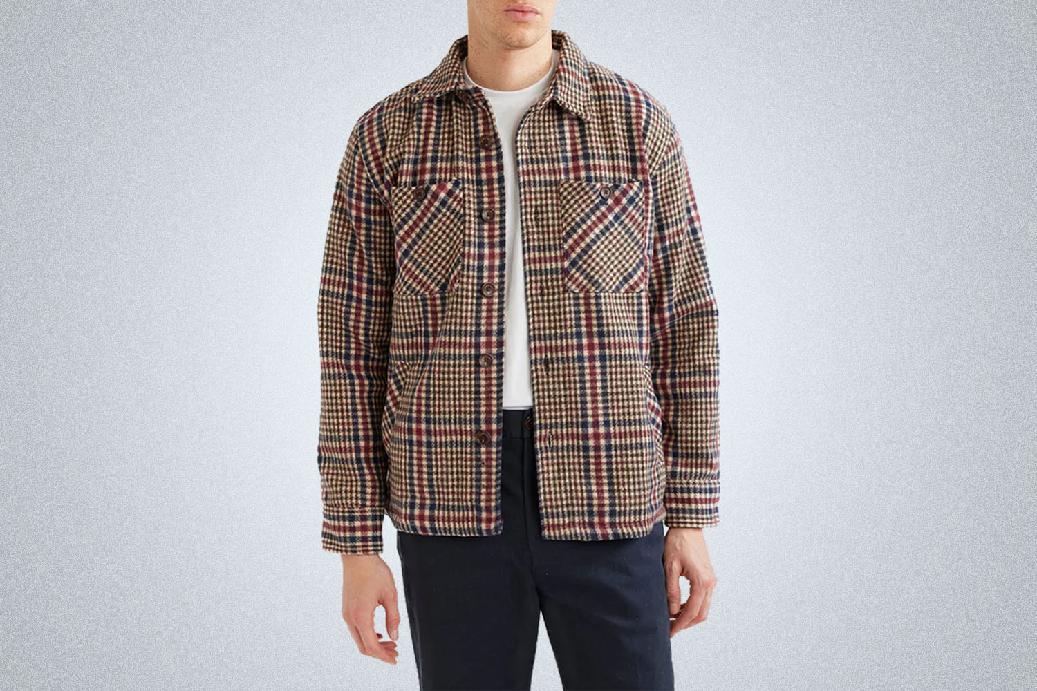 a Percival Check Overshirt on a grey background