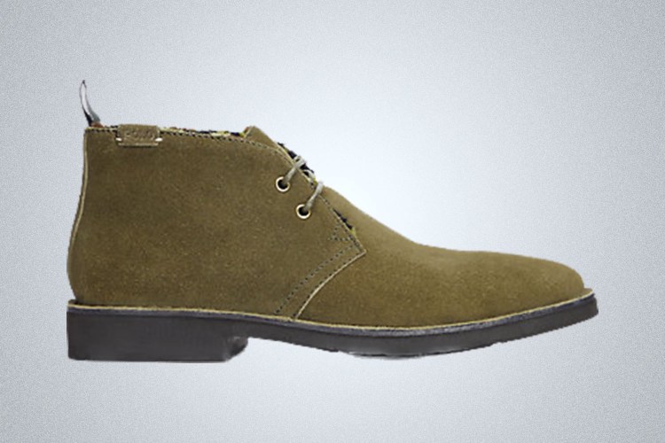A pair of suede Polo Ralph Lauren Chukka Boots on a grey background