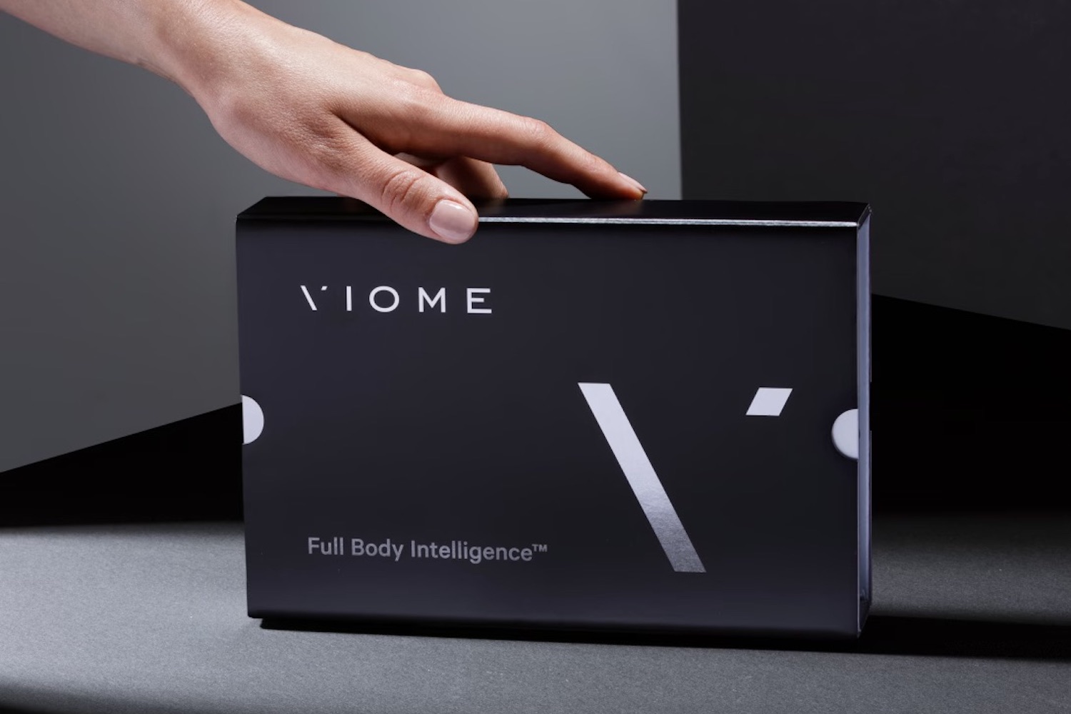 a Viome test box on a black table