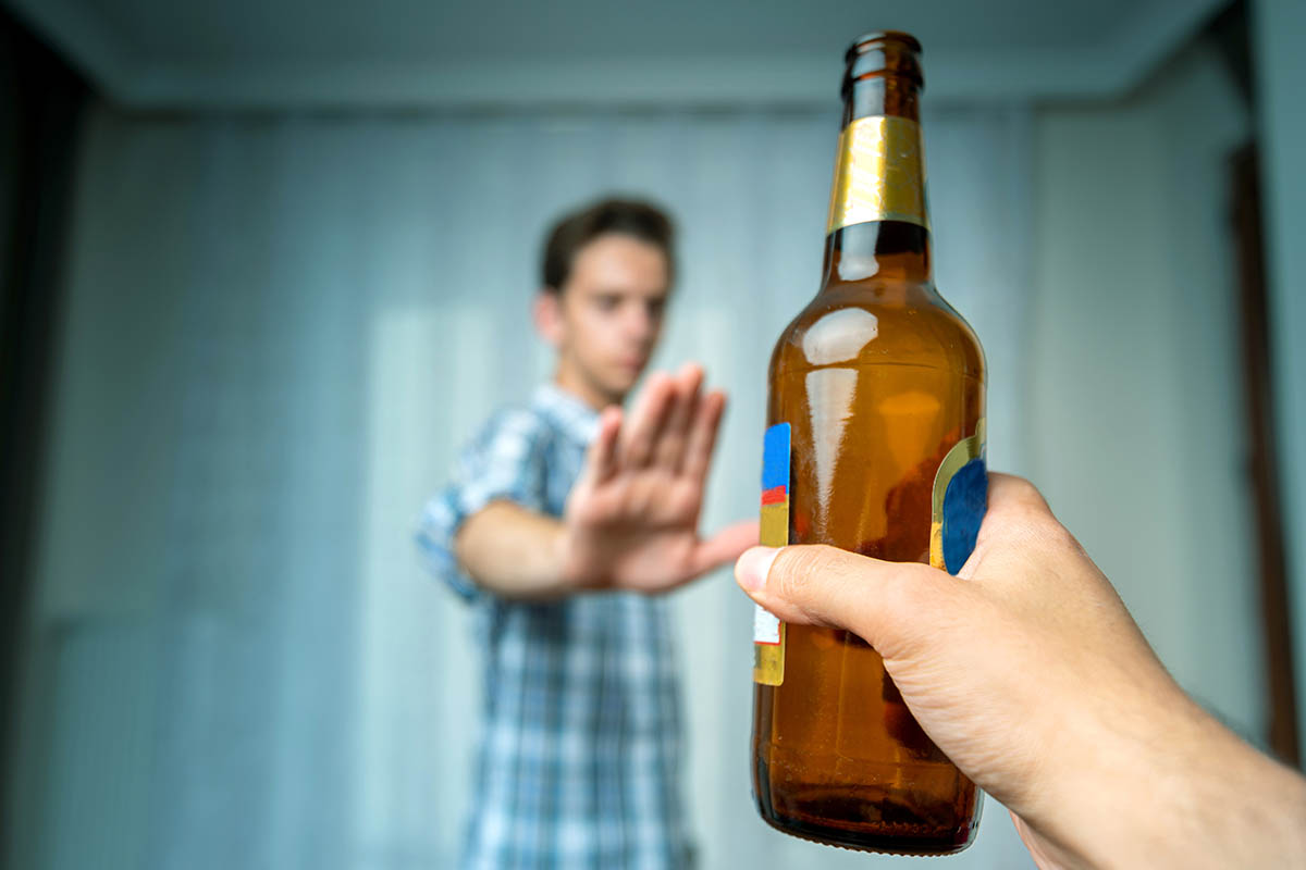 Man hand rejecting alcoholic beer beverage