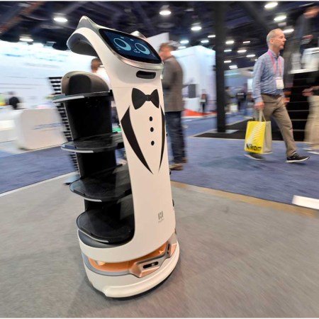 A Pudu BellaBot delivery robot moves through a booth during at CES 2023 at the Las Vegas Convention Center on January 05, 2023 in Las Vegas. Some critics claim too much of the tech at CES didn't keep privacy or digital security in mind for consumers