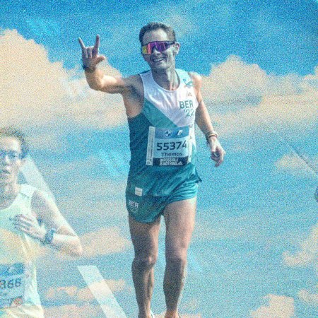 A photo of German marathoner Thomas Eller against a background of blue skies.