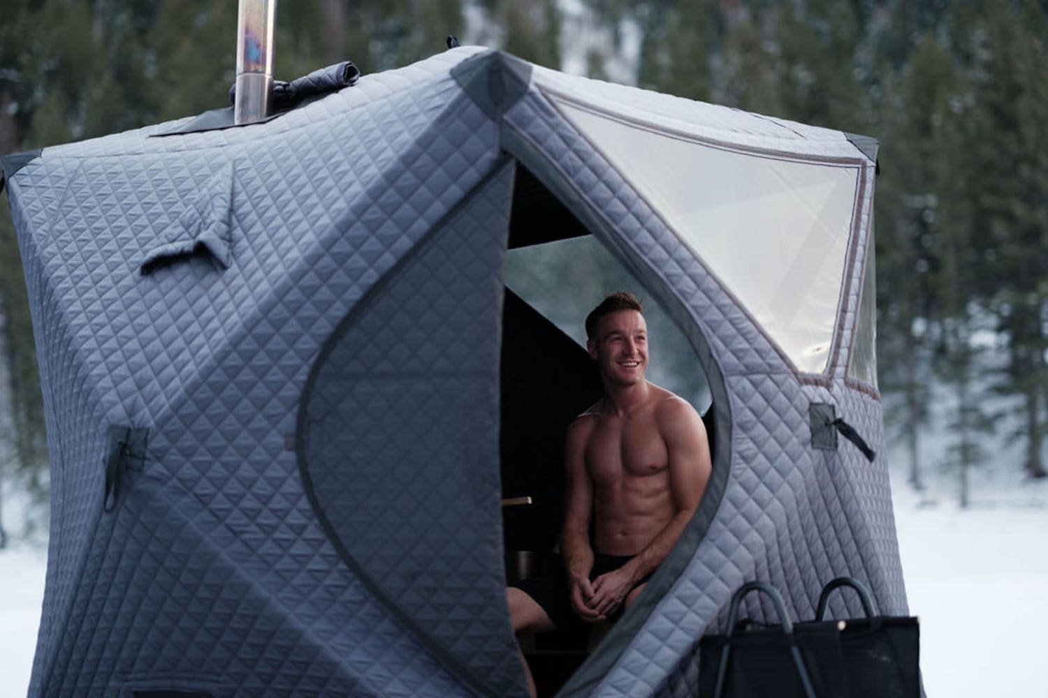 a model in a sauna tent outdoors