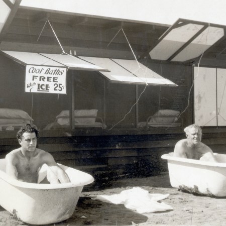 Two men sitting in bathtubs filled with ice. Apparently cold plunge pools are now sites for business meetings.