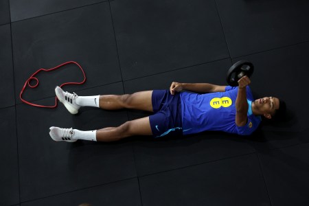 An athlete working out on the ground.
