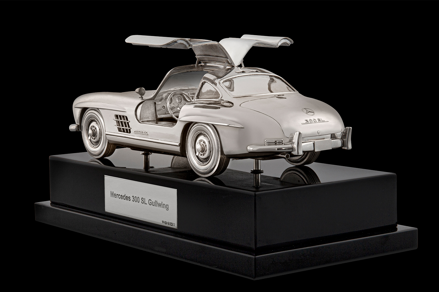 A silver replica of a Mercedes 300 SL Gullwing made by Anthony Holt & Sons