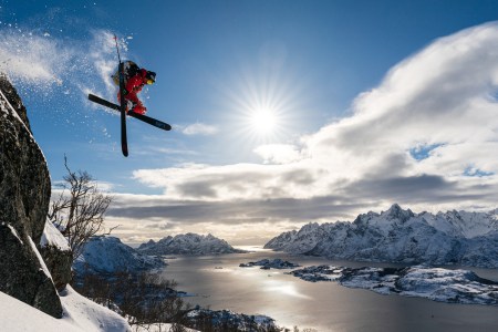 Skier Adam Ü jumping off a cliff in Norway's Lofoten Islands