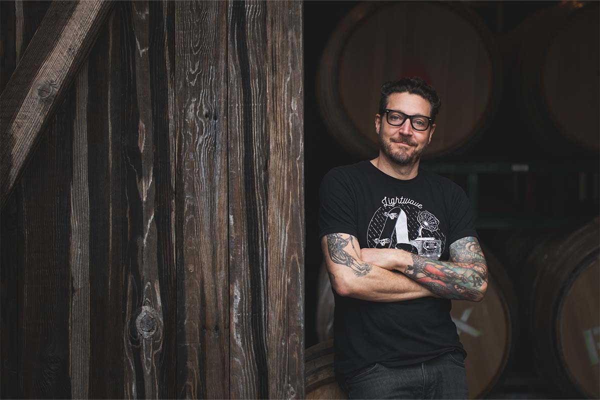 Patrick Cappiello, former Food & Wine “Sommelier of the Year” turned California winemaker, standing near barrels of wine