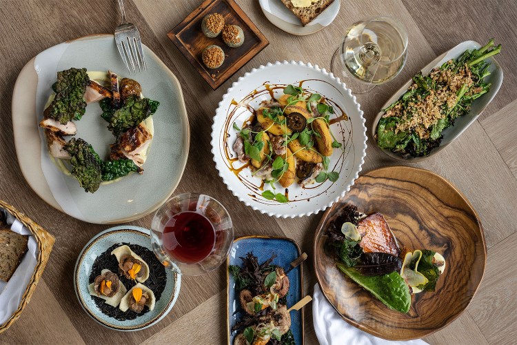 An overhead shot of dishes from Quarter Acre in Dallas, one of the best new Texas restaurants in January 2023