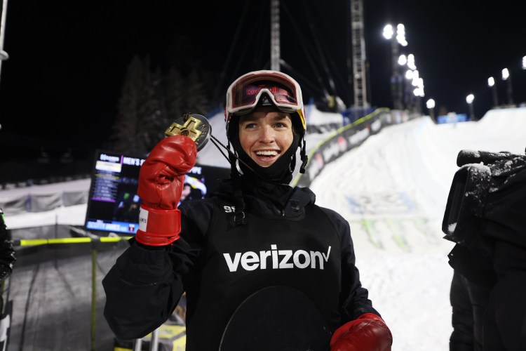 Scotty James holds up a medal after winning the halfpipe at the X Games.