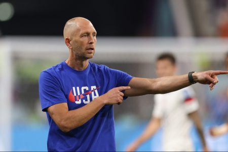 Gregg Berhalter gives directions at the World Cup against the Netherlands.