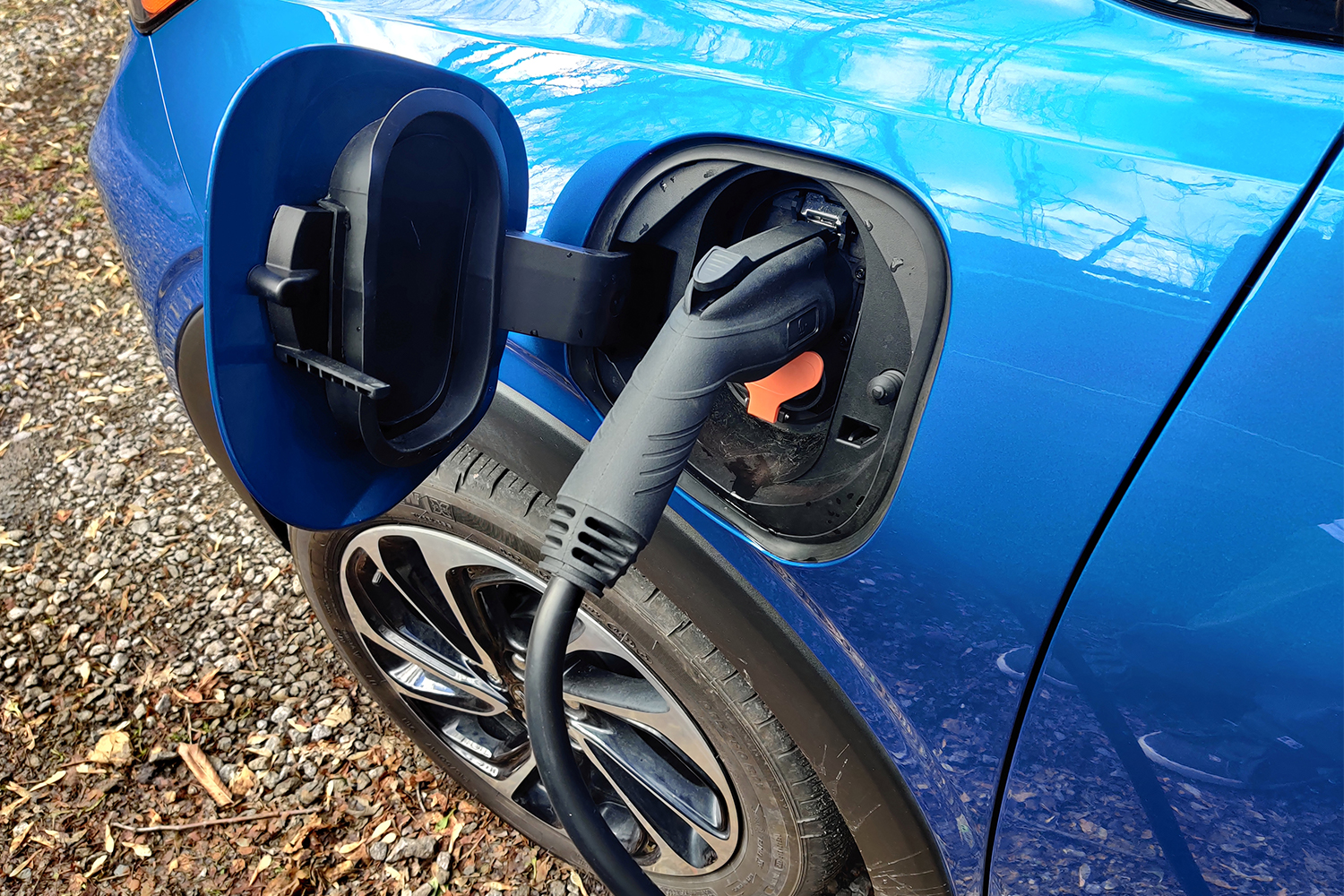 The charging plug of a Wallbox Pulsar Plus plugged into a Chevrolet Bolt EUV