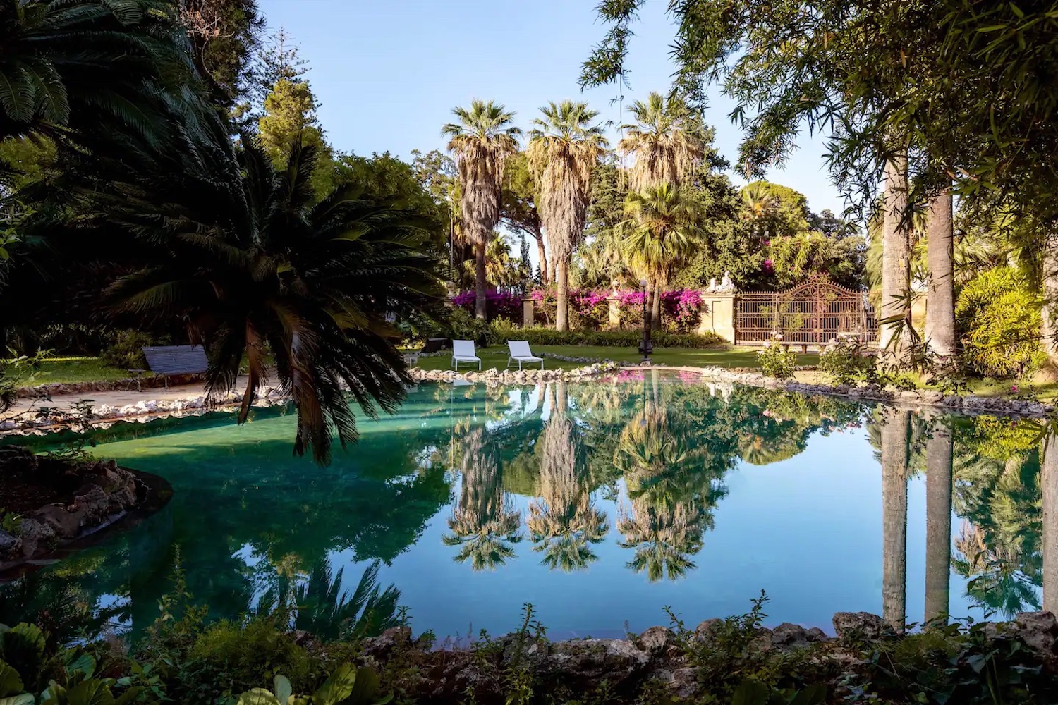 The pool surrounded by trees at Villa Tasca in Sicily, the house Harper and Daphne visit in "The White Lotus"