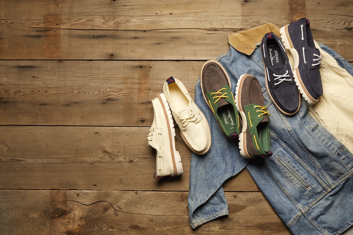 a trio of Sperry x Rowing Blazer boat shoes on a wooden background