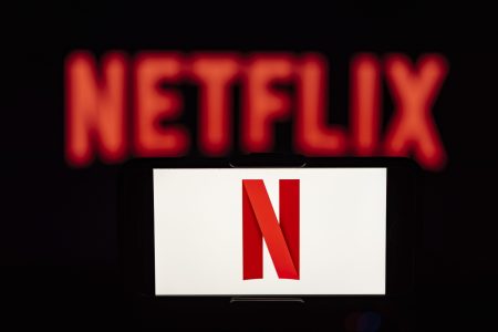Streaming service Netflix, which is shown here in a photo illustration, released its new password-sharing rules for the U.S.