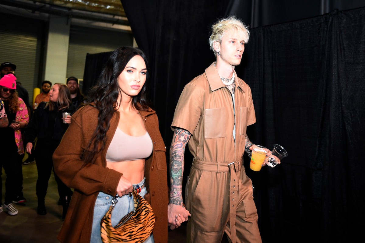 Megan Fox and Machine Gun Kelly arrive backstage during the UFC 261 event at VyStar Veterans Memorial Arena