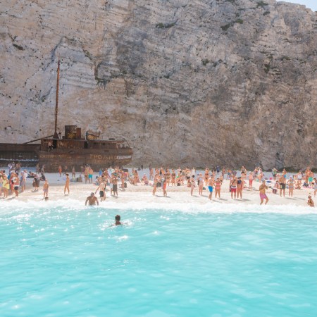 crowds of people at shipwreck beach in Zakynthos, Greek Islands