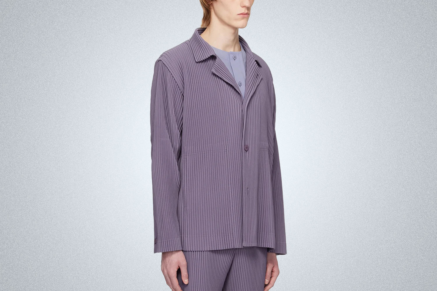 a model in a purple Homme Plisse Purple Tailored Pleats 1 Blazer on grey background 