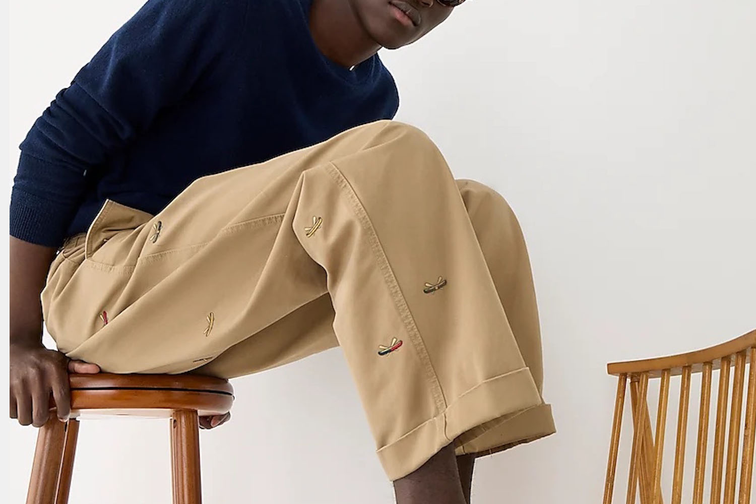 a model in a pair of J.Crew Giant-Fit Chinos on a grey background